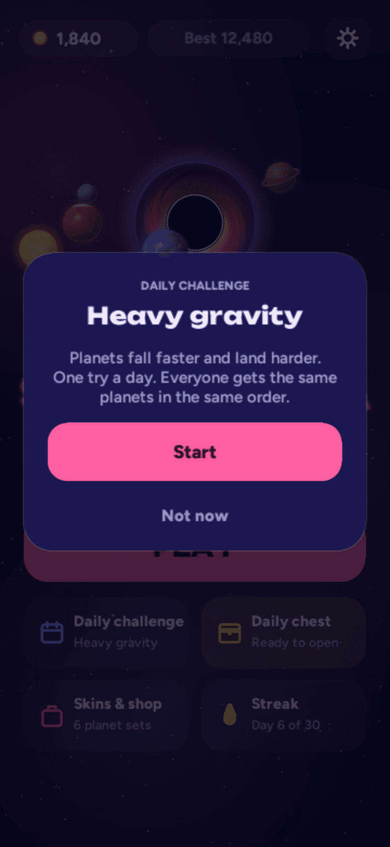 Daily challenge card — 'Heavy gravity': planets fall faster and land harder, one try a day.