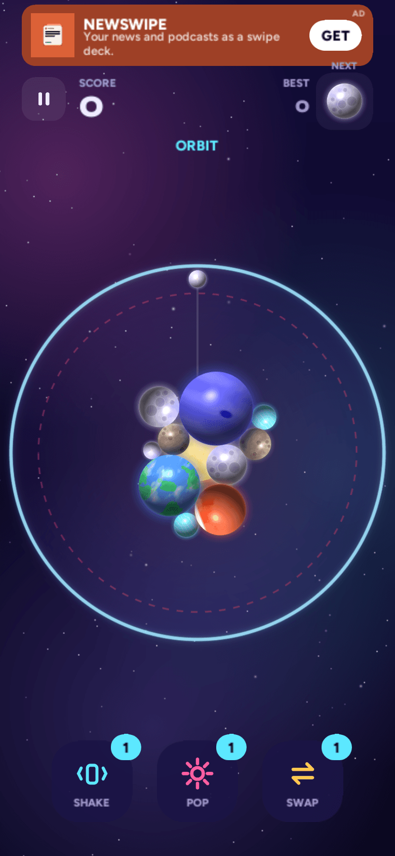 Orbit mode — planets clustered around a central sun inside a circular arena, the dropper on the rim.